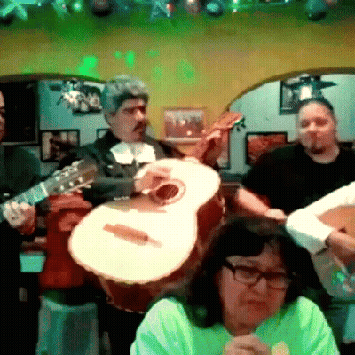 Group Playing Guitars Under Green Lights GIF