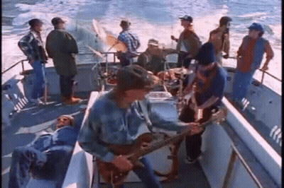 Group Playing Instruments On A Boat GIF