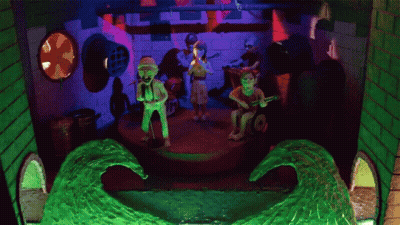 Group Playing Instruments On Stage With Wave GIF