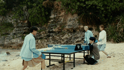 Group Playing Ping Pong On Beach GIF