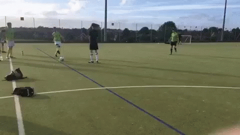 Group Playing Soccer On Field GIF