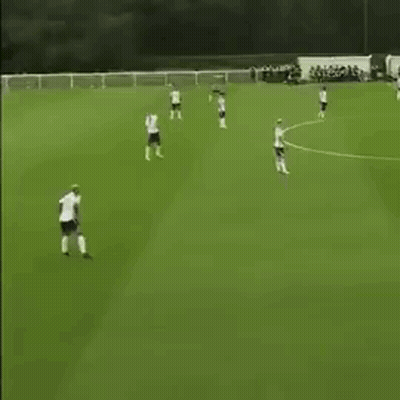 Group Playing Soccer On Green Field GIF