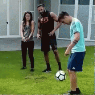 Group Playing Soccer On Lush Green Field GIF