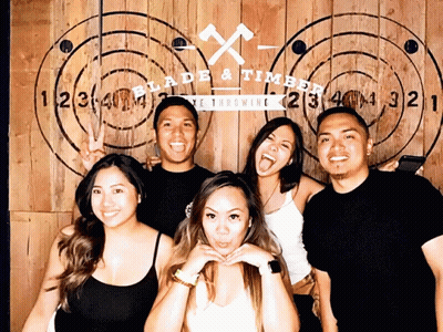 Group Posing Before Wooden Wall Blade & Timber GIF