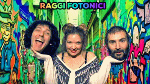Group Posing In Front Of Graffiti Wall Raggi Fotonici GIF