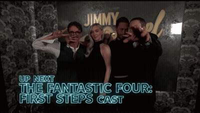 Group Posing in Front of Jimmy Sign