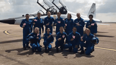 Group Posing In Front Of NASA Airplane GIF