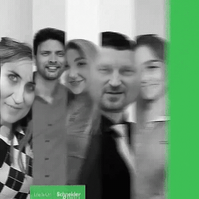 Group Posing With Life Is On Schneider Sign GIF