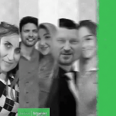 Group Posing With Schneider Sign GIF
