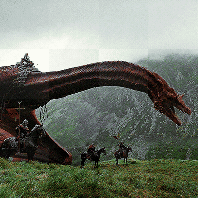 Group Riding Horses In Front Of Red Dragon GIF