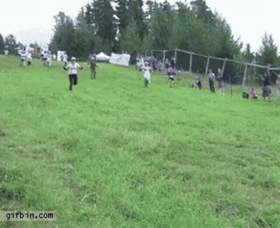 Group Running Down Hill In Field GIF