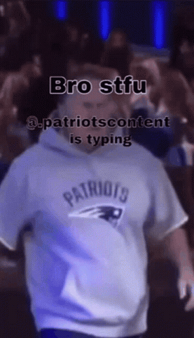 Group Running In Front Of Brick Building With Man On Their Back GIF