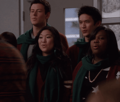 Group Singing In Scarves And Sweaters GIF