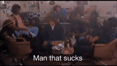 Group Sitting Around Table Saying Man That Sucks GIF