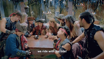 Group Sitting Around Table We Ride With The Tide GIF