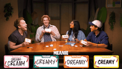 Group Sitting Around Table With Creamy Labels GIF