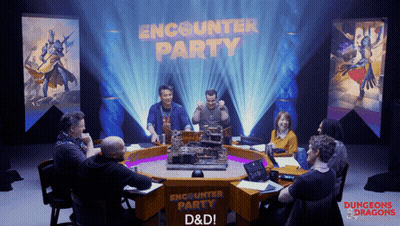 Group Sitting Around Table With Encounter Party Sign GIF