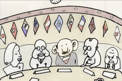 Group Sitting Around Table With Flags GIF