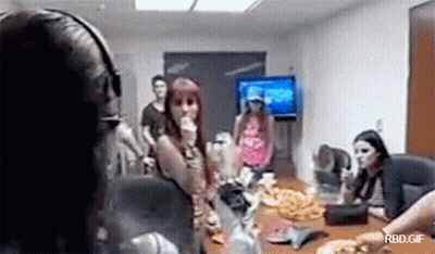 Group Sitting Around Table With TV GIF
