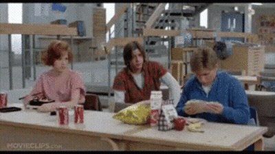 Group Sitting At Cafeteria Table Eating GIF