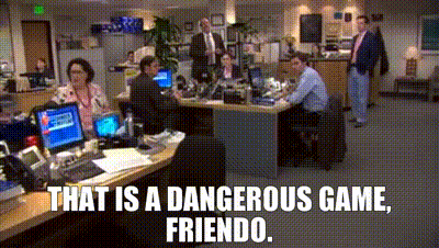 Group Sitting At Desks Saying That Is A Dangerous Game Friend GIF