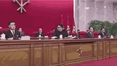 Group Sitting At Long Table GIF