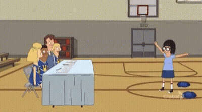 Group Sitting At Table In Gym GIF