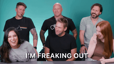 Group Sitting At Table Saying I'm Freaking Out GIF