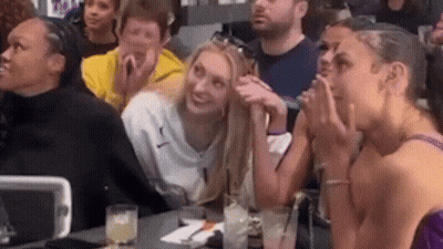 Group Sitting At Table With Drinks GIF