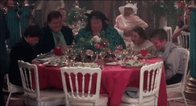 Group Sitting At Table With Food And Wine GIF