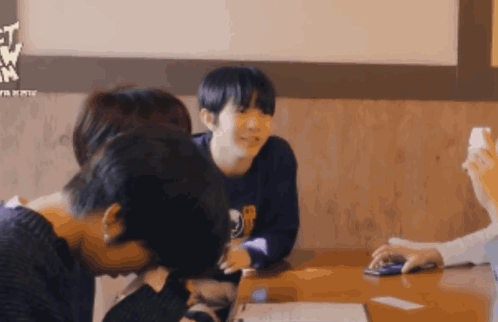 Group Sitting At Table With Lets Go Sign GIF