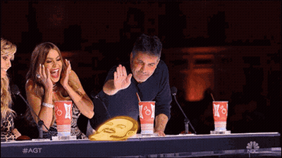 Group Sitting At Table With NBC Cups GIF