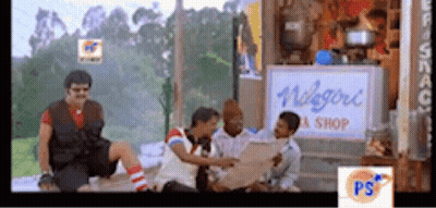 Group Sitting Before Niagara Tea Shop Sign GIF