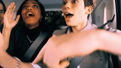 Group Sitting In Back Seat With Hands Up GIF