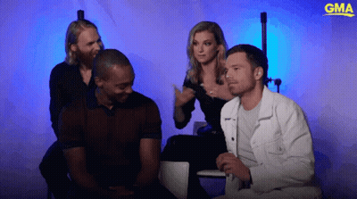 Group Sitting In Front Of Blue Background With GMA Logo GIF