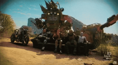 Group Sitting In Front Of E3 Live Vehicle GIF