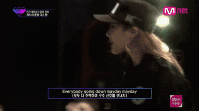 Group Sitting In Front Of Mnet Sign GIF
