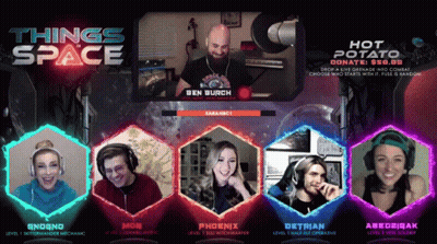 Group Sitting In Front Of Space Sign GIF
