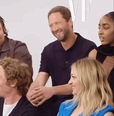 Group Sitting In Front Of Wall With VF GIF