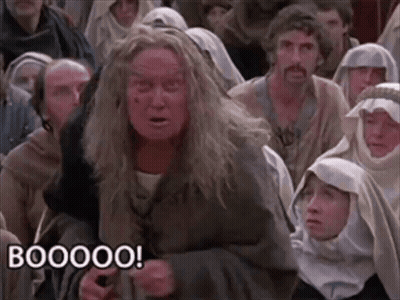 Group Sitting In Room One Making Funny Face Saying Booooo GIF