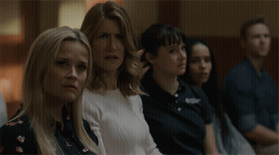 Group Sitting In Room With Amanda Shirt GIF