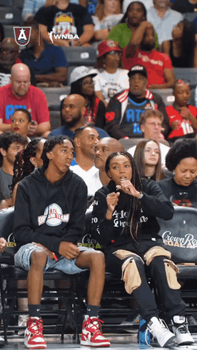 Group Sitting In Stands At Crown Royal Basketball Game GIF