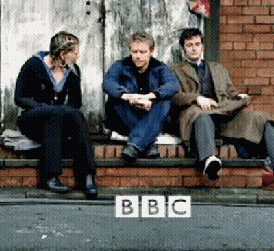 Group Sitting On Brick Wall With BBC Logo GIF