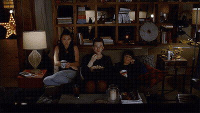 Group Sitting On Couch Eating Popcorn GIF
