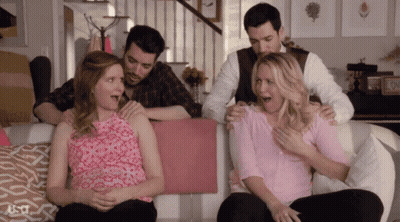 Group Sitting On Couch Holding Pregnant Woman GIF