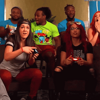Group Sitting On Couch One Wearing EOL Shirt GIF