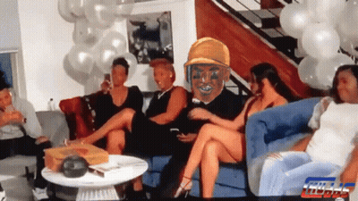 Group Sitting On Couch With Balloons And Man In Yellow Hat GIF