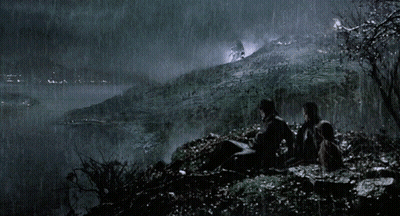 Group Sitting On Hill Looking At Waterfall GIF