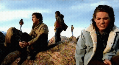 Group Sitting On Large Rock GIF