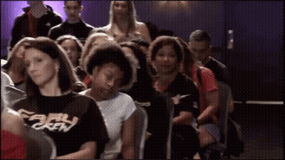 Group Sitting, One Wearing Early Crew Shirt GIF